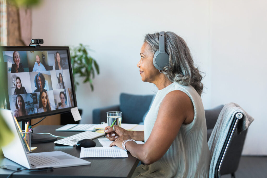 Woman meeting with employees from home